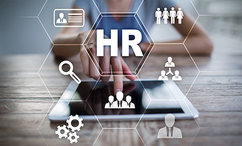 person interacting with tablet displaying HR icons and graphics emphasizing recruitment and employee management strategies